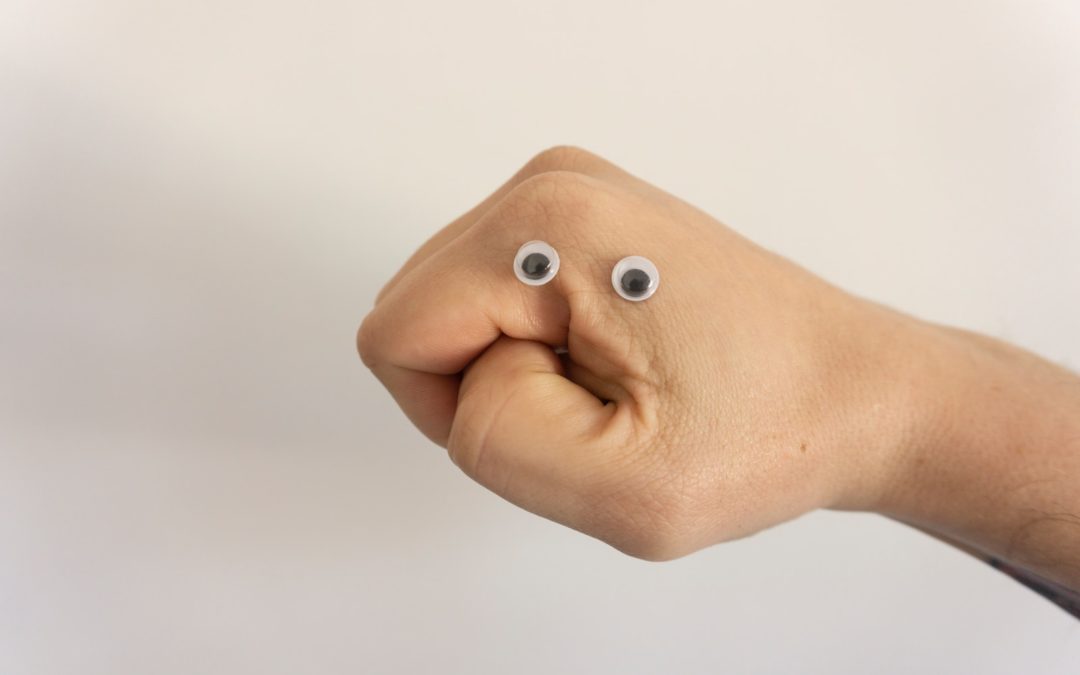 person holding brown heart shaped bread