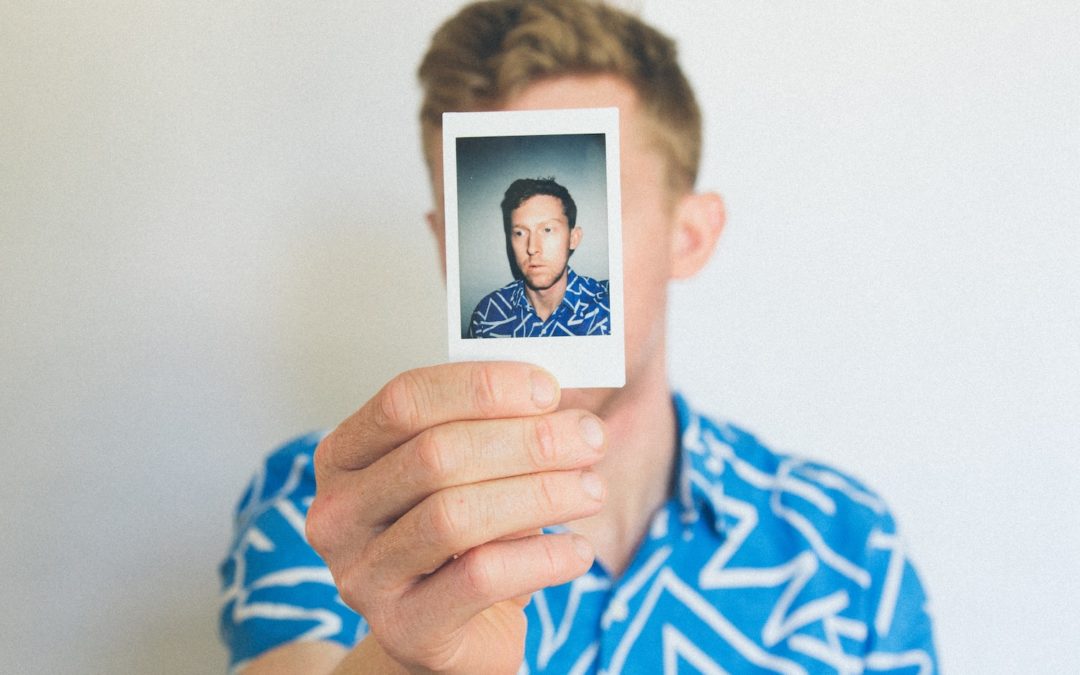 man showing photo of him